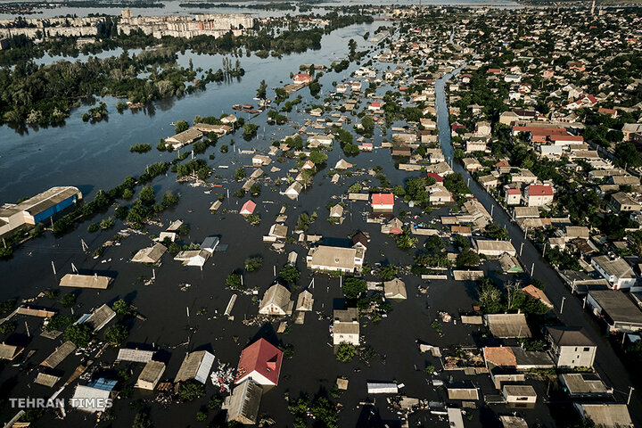 Streets are flooded in Kherson, Ukraine, on June 7, after the Kakhovka dam collapsed. [Libkos/AP Photo]
