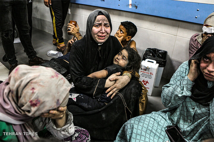 Wounded Palestinians wait for treatment at al-Shifa Hospital in Gaza City, central Gaza Strip, after arriving from al-Ahli hospital following an explosion there. [Abed Khaled/AP Photo]
