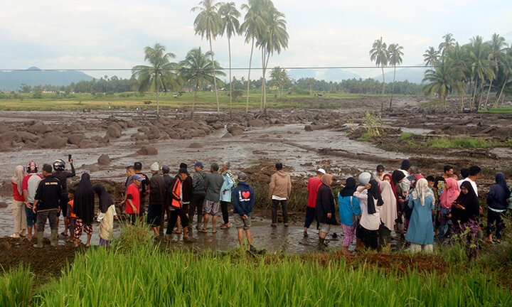 At least 12 dead after Indonesia flash floods, cold lava flow