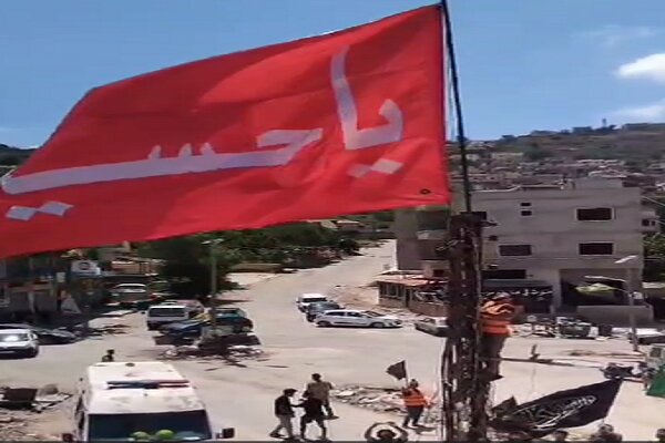 VIDEO: Imam Hussein (AS) flag raised in southern Lebanon