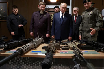 Putin inspects troops with Kadyrov on his Chechnya visit