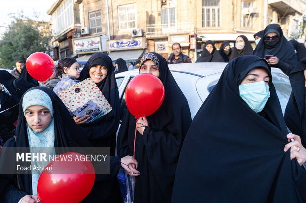 Iranian women gather in front of UK embassy