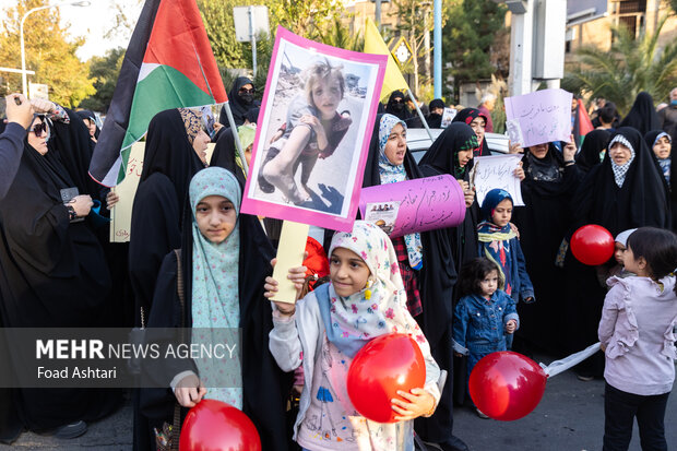 Iranian women gather in front of UK embassy