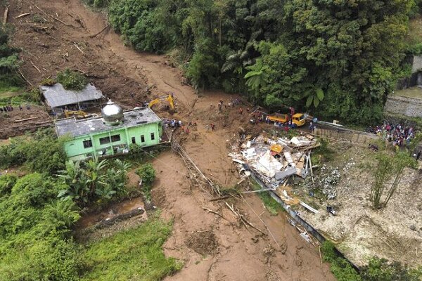 Indonesia digs out as flooding, landslide death toll hits 20