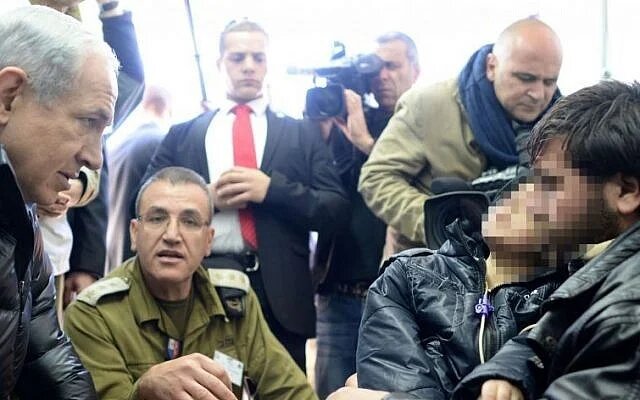 Prime Minister Benjamin Netanyahu visits an Israeli military field hospital in the Golan Heights on February 18, 2014 that treats rebels wounded in fighting in Syria. (Kobi Gideon /GPO/FLASH90)