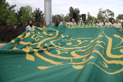 تعویض پرچم رضوی در میدان قائم آمل
