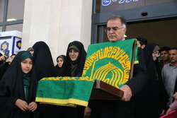 مراسم استقبال از خادمین و پرچم متبرک حرم رضوی در کرمانشاه