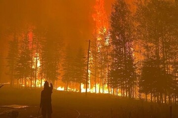 Canadian wildfire emergency spreads to second province