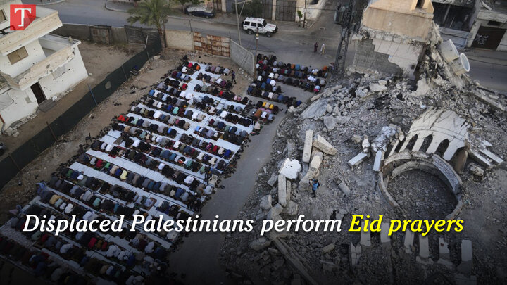 Displaced Palestinians perform Eid prayers