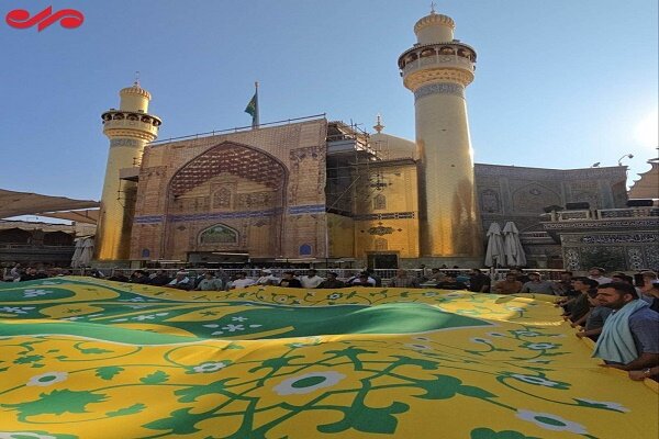 Gadir Kutlamaları'nda asılacak bayraklar, İmam Ali türbesinde kutsandı (+foto)