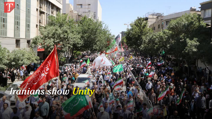 Iranians take to the streets to show unity