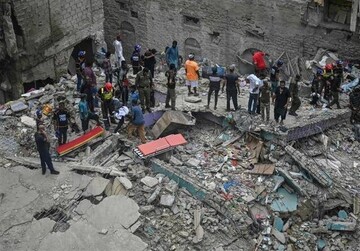 Search continues after Pakistan building  collapse kills 14