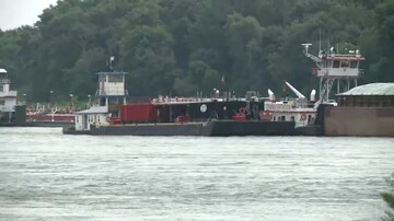 Helicopter crash on Mississippi River barge kills 2