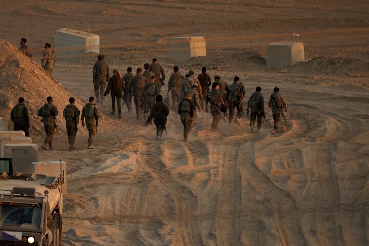 Israeli soldiers walk near the Israel-Gaza border, October 10, 2025.