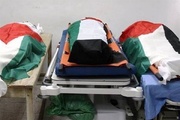 انتقال پیکر ۵۴ شهید فلسطینی به بیمارستانی در غزه