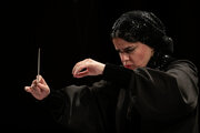 Iranian woman leads national orchestra for first time