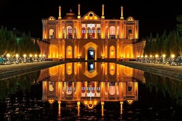 Mansion and its scenic reflection inside Kerman’s Fat’h Abad Garden