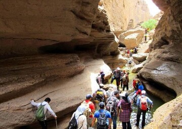 Travelers tour bizarre-shaped landscapes of Rageh Canyon situated some 20 kilometers southeast of Rafsanjan, a historical city in southern Iran. 