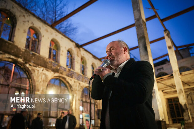 Performing prayers at burnt Hojjatieh Mosque in Rasht
