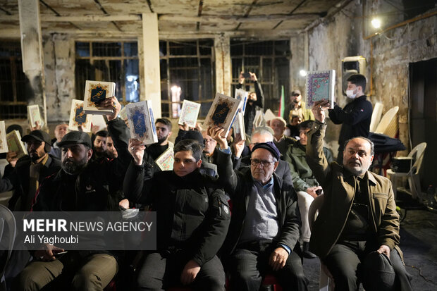 Performing prayers at burnt Hojjatieh Mosque in Rasht
