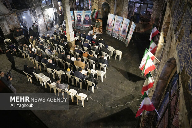 Performing prayers at burnt Hojjatieh Mosque in Rasht
