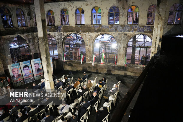 Performing prayers at burnt Hojjatieh Mosque in Rasht
