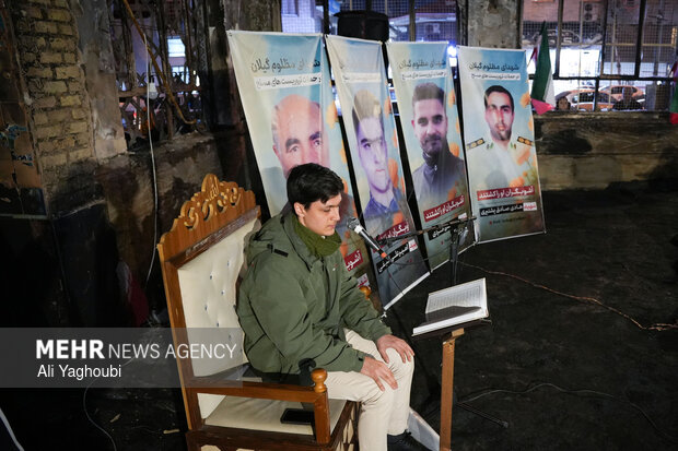 Performing prayers at burnt Hojjatieh Mosque in Rasht
