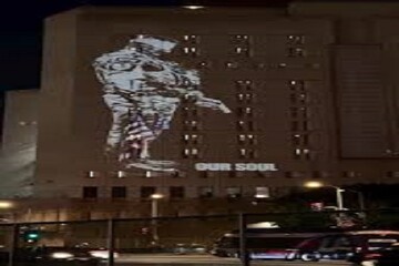 VIDEO: Protest light display projected onto ICE center