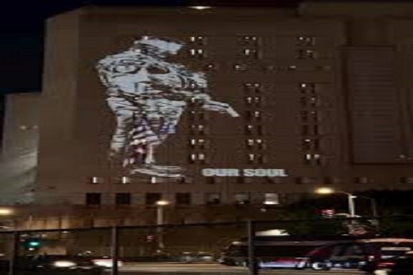 VIDEO: Protest light display projected onto ICE center