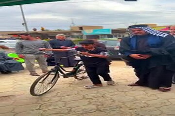 VIDEO: Iraqi boy donates bicycle as only asset to back Iran