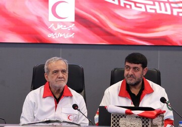 President Masoud Pezeshkian (L) and Pirhossion Kolivand, the head of the Iranian Red Crescent Society.