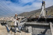 در پل B۱ برابر مرگ عکاسی کردم؛ سنگینی آخرین آغوش کودک یک‌ساله