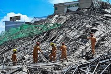 Rescuers search for 20 after bldg. collapse in Philippines