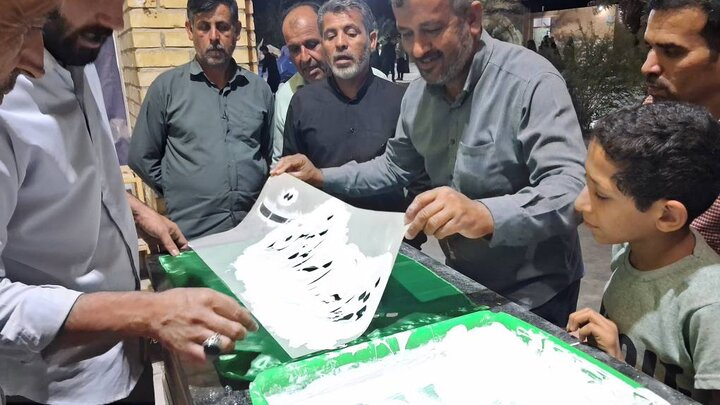 آیین سنتی پرچم نویسی در آبدان برگزار شد