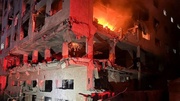 VIDEO: A girl rescued from an apt. fire after Israeli strike