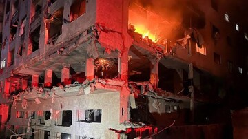 VIDEO: A girl rescued from an apt. fire after Israeli strike
