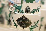 آماده‌سازی کیک جشن میلاد حضرت زینب(س) در حرم رضوی