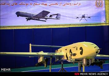 Iran unveils drone equipped with air defense missiles